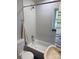 Clean bathroom featuring white tile, a shower/tub, toilet and vintage sink at 7107 Wilson Grove Rd, Mint Hill, NC 28227