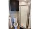 Small bathroom featuring a frosted glass shower door, toilet, and dark storage cabinet at 7107 Wilson Grove Rd, Mint Hill, NC 28227