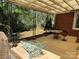 Covered outdoor patio area with furniture overlooking a large fenced-in backyard at 7107 Wilson Grove Rd, Mint Hill, NC 28227