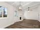 Living room featuring fireplace and exterior door at 7124 Lake Dr, Matthews, NC 28104