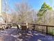 Outdoor deck featuring chairs and a table with scenic views, ideal for relaxation and gatherings at 7509 Thorn Creek Ln, Tega Cay, SC 29708