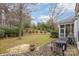 Spacious backyard featuring a brick patio, lush greenery, and a tranquil outdoor space at 786 Platinum Dr, Fort Mill, SC 29708