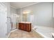 Bright bathroom with walk-in shower, vanity, and soaking tub at 786 Platinum Dr, Fort Mill, SC 29708