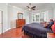 Inviting bedroom with bay window, ceiling fan, and hardwood floors at 786 Platinum Dr, Fort Mill, SC 29708