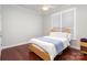 Comfortable bedroom with white linens, hardwood floor, and bright window at 786 Platinum Dr, Fort Mill, SC 29708