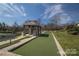 Bocce ball court in the community with covered shelter, outdoor seating and well-maintained lawn at 786 Platinum Dr, Fort Mill, SC 29708