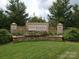 Welcoming Four Seasons community entrance featuring lush landscaping and stone signage at 786 Platinum Dr, Fort Mill, SC 29708