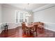 Elegant dining room featuring hardwood floors, bay window, and modern chandelier at 786 Platinum Dr, Fort Mill, SC 29708