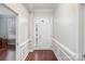 Inviting home foyer featuring hardwood floors, decorative molding, and a bright front door with transom window at 786 Platinum Dr, Fort Mill, SC 29708