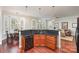 Spacious kitchen featuring dark granite counters, wooden cabinets, stainless appliances, and an open layout design at 786 Platinum Dr, Fort Mill, SC 29708