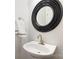 Modern powder room features a stylish round mirror and towel rack at 786 Platinum Dr, Fort Mill, SC 29708