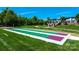 Enjoy a game of shuffleboard on this pristine court surrounded by lush green grass and beautiful landscaping at 786 Platinum Dr, Fort Mill, SC 29708