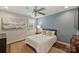 A cozy bedroom with a queen bed, ceiling fan, and stylish decor for relaxation at 830 Jefferson Dr, Charlotte, NC 28270