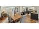 Dining room with open floor plan, hardwood floors, and views of the updated kitchen and living spaces at 830 Jefferson Dr, Charlotte, NC 28270