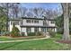 Charming two-story home featuring a landscaped front yard and brick walkway at 830 Jefferson Dr, Charlotte, NC 28270