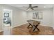 Game room with a foosball table and hardwood floors; bedroom is visible through the doorway at 830 Jefferson Dr, Charlotte, NC 28270