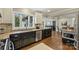 Well-appointed kitchen with granite countertops, stainless steel appliances, and a view of the dining area at 830 Jefferson Dr, Charlotte, NC 28270