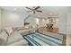 The living area features a sectional sofa, a striped rug, and hardwood floors at 830 Jefferson Dr, Charlotte, NC 28270