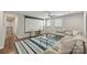 Spacious living room with plush seating, a media screen, and ample natural light at 830 Jefferson Dr, Charlotte, NC 28270