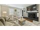 Inviting living room with a fireplace, built-in shelving, and comfortable seating for relaxation at 830 Jefferson Dr, Charlotte, NC 28270