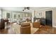 Bright living room features hardwood floors, fireplace, neutral colors, and French doors to the backyard at 830 Jefferson Dr, Charlotte, NC 28270