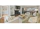 Cozy living room featuring a brick fireplace, built-in shelves, and comfortable seating arrangement at 830 Jefferson Dr, Charlotte, NC 28270