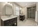 Main bathroom featuring double vanities, glass shower and tiled floor at 830 Jefferson Dr, Charlotte, NC 28270