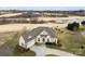 Aerial view of home on a golf course, showcasing a neatly landscaped yard and picturesque surroundings at 103 Caddies Ct, Shelby, NC 28150