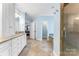 A spacious bathroom offers dual vanities, tiled floor, and a walk in shower at 103 Caddies Ct, Shelby, NC 28150