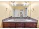 Bathroom features double sinks with granite countertop and a large mirror, offering ample space and modern style at 103 Caddies Ct, Shelby, NC 28150