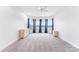 Neutral bedroom with large bay windows, carpeted floors, and ample closet space at 103 Caddies Ct, Shelby, NC 28150