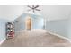 Bedroom features neutral walls and carpet, and a ceiling fan offering brightness and space at 103 Caddies Ct, Shelby, NC 28150