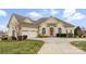 Charming home boasts a manicured lawn, a red front door, and a three-car garage at 103 Caddies Ct, Shelby, NC 28150