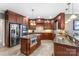 Gourmet kitchen boasts granite countertops, stainless steel appliances, a central island, and custom cabinetry at 103 Caddies Ct, Shelby, NC 28150
