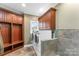 Convenient laundry room offers ample storage and cabinetry with washer and dryer at 103 Caddies Ct, Shelby, NC 28150