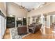Inviting living space showcasing a fireplace, built-in shelving, comfortable leather seating, and hardwood floors at 103 Caddies Ct, Shelby, NC 28150