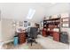Office featuring a skylight, dark wood furniture, and neutral walls and carpet offering brightness and style at 103 Caddies Ct, Shelby, NC 28150
