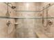 The walk-in shower features tile walls, shelving and a seat in a neutral color palette at 103 Caddies Ct, Shelby, NC 28150