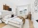 Inviting bedroom with neutral tones, natural lighting, and a stylish accent wall hanging at 1030 Rolling Meadows Dr # Rm13, Mooresville, NC 28115