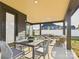 A beautifully appointed covered patio, perfect for entertaining with its comfortable seating and elegant dining area at 1030 Rolling Meadows Dr # Rm13, Mooresville, NC 28115