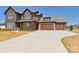 Spacious driveway leading to a beautiful home with a mix of stone and siding accents at 1030 Rolling Meadows Dr # Rm13, Mooresville, NC 28115