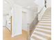 Welcoming entryway with hardwood staircase adjacent to the modern kitchen at 1030 Rolling Meadows Dr # Rm13, Mooresville, NC 28115