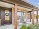 Charming front porch with brick accents, stylish seating, and a welcoming entrance at 1030 Rolling Meadows Dr # Rm13, Mooresville, NC 28115