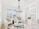 Bright living room with coffered ceiling, large windows, and elegant chandelier for a sophisticated feel at 1030 Rolling Meadows Dr # Rm13, Mooresville, NC 28115
