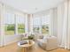 Sunlit sitting area with neutral decor, large windows, and hardwood floors at 1030 Rolling Meadows Dr # Rm13, Mooresville, NC 28115