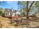 Expansive backyard featuring a deck, fire pit area, and plenty of space for outdoor activities at 1101 Lancaster Ave, Monroe, NC 28112