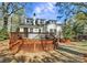 Lattice back deck with chimney and patio view of the lush, private backyard at 1101 Lancaster Ave, Monroe, NC 28112