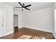 Bedroom showcasing wood floors, a ceiling fan, and ample natural light at 1101 Lancaster Ave, Monroe, NC 28112