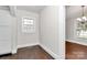 Cozy dining room with hardwood floors, white trim, natural light, and adjacent kitchen at 1101 Lancaster Ave, Monroe, NC 28112