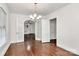 Dining room features hardwood floors, chandelier, and french doors to another room at 1101 Lancaster Ave, Monroe, NC 28112